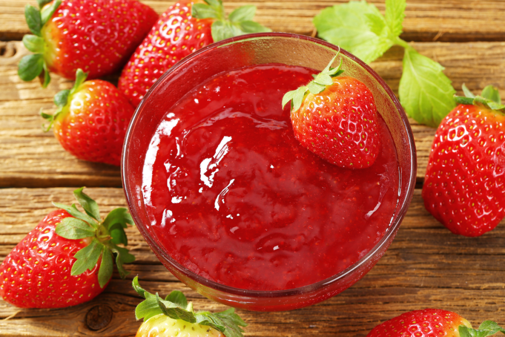 A Smooth and vibrant homemade strawberry purée in a jar