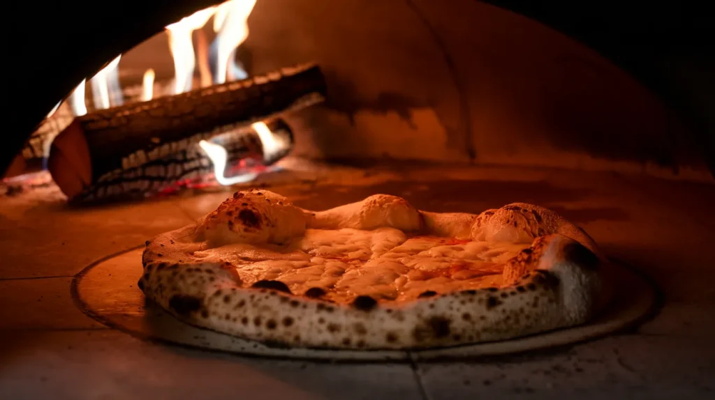 pizza inside a wood-fired oven