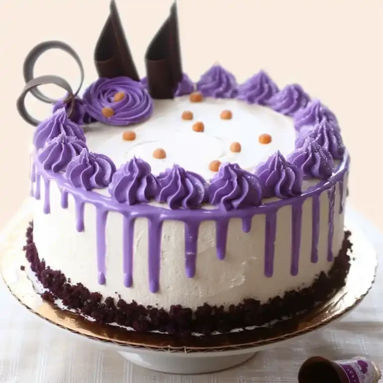 Ube Cake: The Fluffy Filipino Dessert Everyone’s Obsessed With 7 Traditional Filipino ube cakes with purple frosting and chocolate decorations on rustic wooden tables.