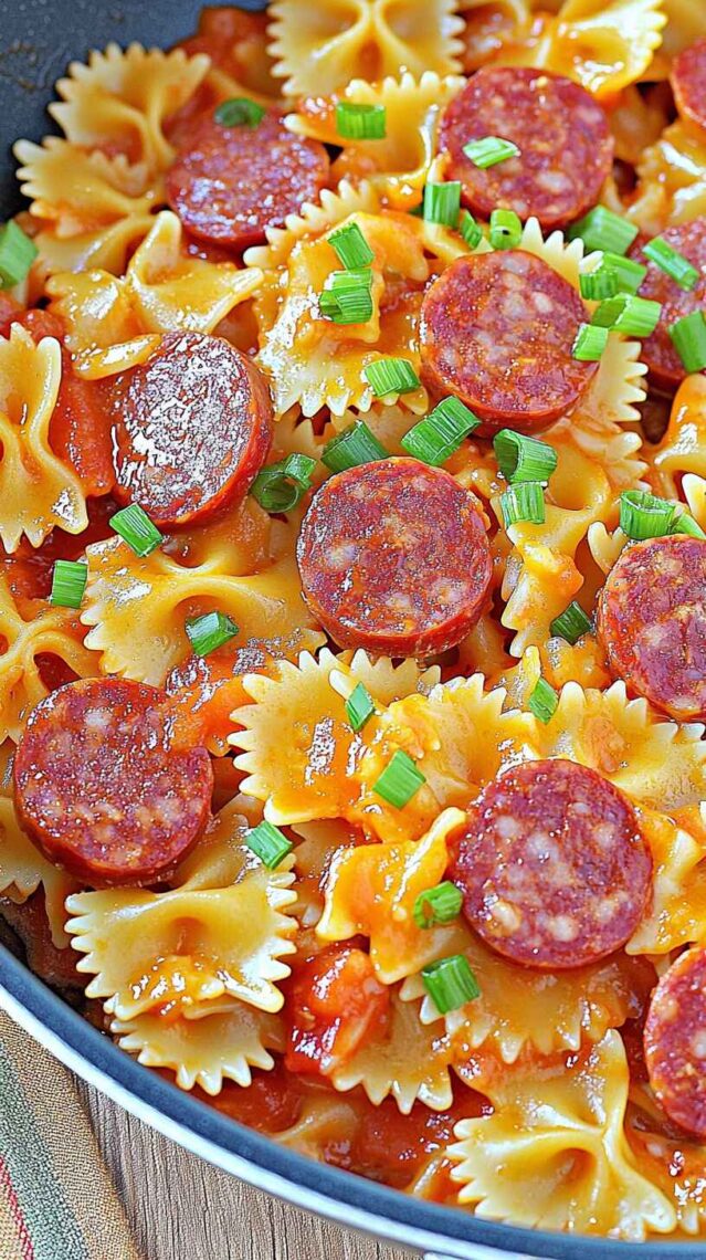 One Pot Kielbasa Pasta – Quick, Cheesy & Family-Loved Dinner 7 One pot kielbasa dinner with bowtie pasta, melted cheese, and sausage slices in a skillet
