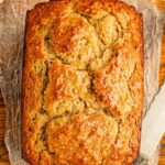 Incredible Apple Bread Recipe That’s Moist, Spiced & Full of Flavor 3 Fresh apple loaf sliced on parchment with green apples behind