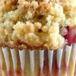 Rhubarb Streusel Muffins: Tangy, Tender & Bakery-Worthy 3 Rhubarb muffin with crumb topping and paper liner