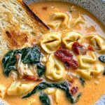 Marry Me Chicken Soup Recipe: Creamy, Cozy, and Irresistibly Comforting 4 Bowl of creamy Marry Me Chicken Soup with tortellini, chicken, spinach, sun-dried tomatoes, and toasted bread.